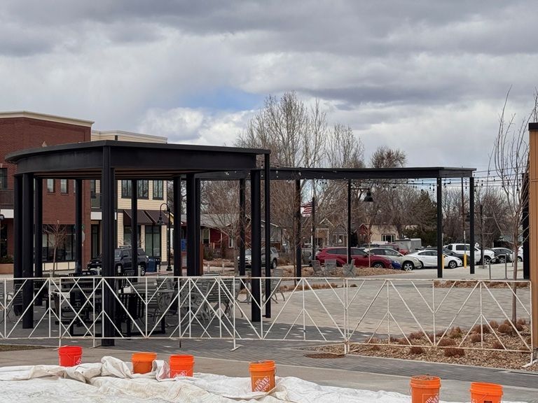 Outdoor curved steel park canopy complete ice rink area
